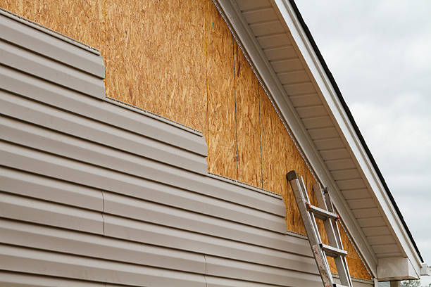 Professional Storm Damage Siding Repair technician working in Grassflat, PA